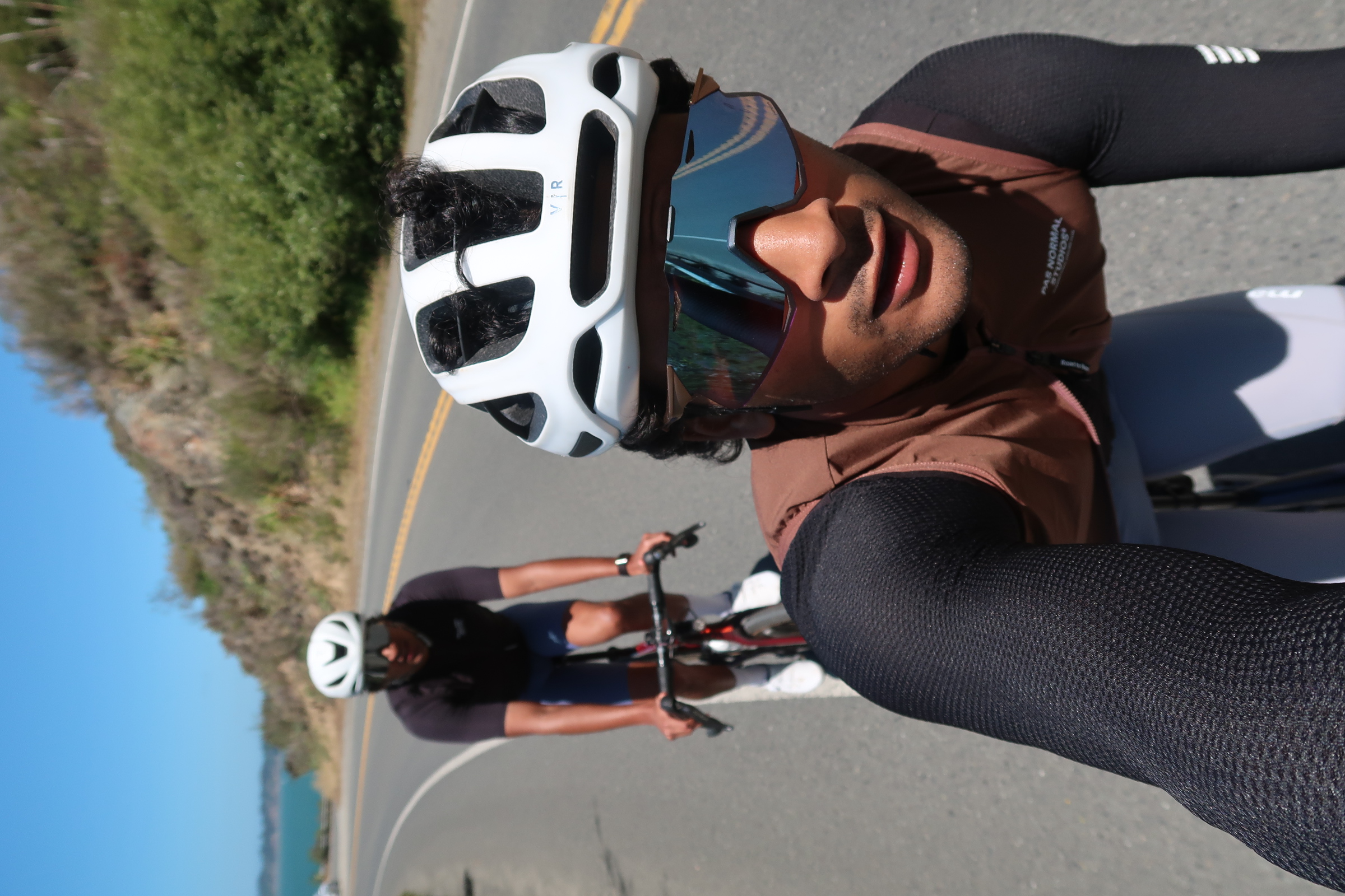 Cyclists riding on a coastal road